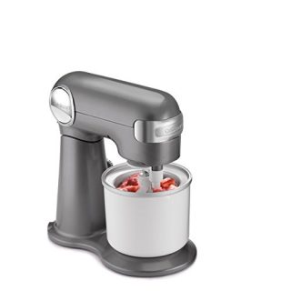 Cuisinart 1.5-quart ice cream maker attachment with built-in mixing paddles and top spout, under a Cuisinart stand mixer, making fresh fruit sorbet.