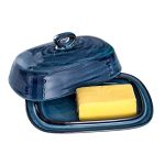 A sleek blue porcelain butter dish with a convenient handle, featuring a smooth glossy finish and a ridge inside to hold butter securely. 