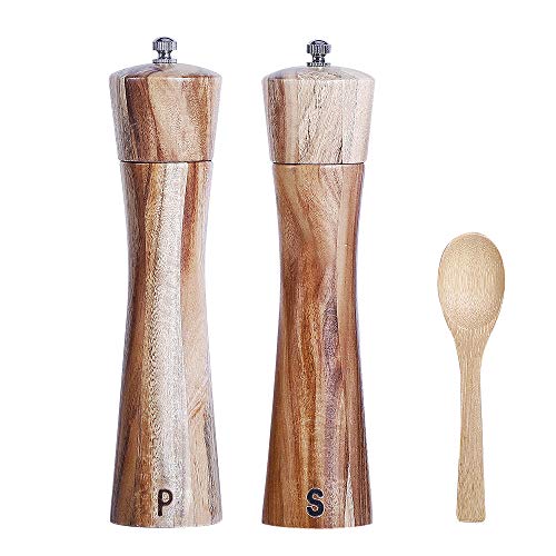 "Wooden salt and pepper grinder set with adjustable coarseness settings and wooden spoon, displayed on a kitchen countertop.