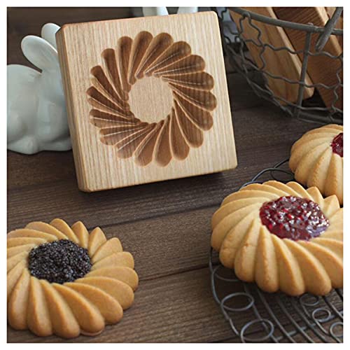 Wooden cookie mold with intricate flower designs, perfect for holiday baking and making professional-looking cookies and pastries.