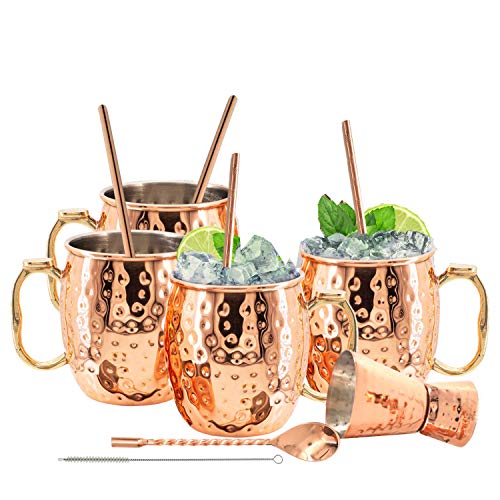 Elegant set of 4 copper Moscow Mule mugs with stainless steel lining, thumb rest handle, straws, jigger, spoon, and brush - perfect for cocktails and bar displays
