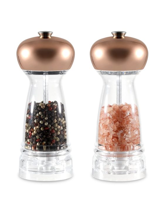 Rose gold salt and pepper grinder set with adjustable coarseness, displayed on a kitchen countertop.